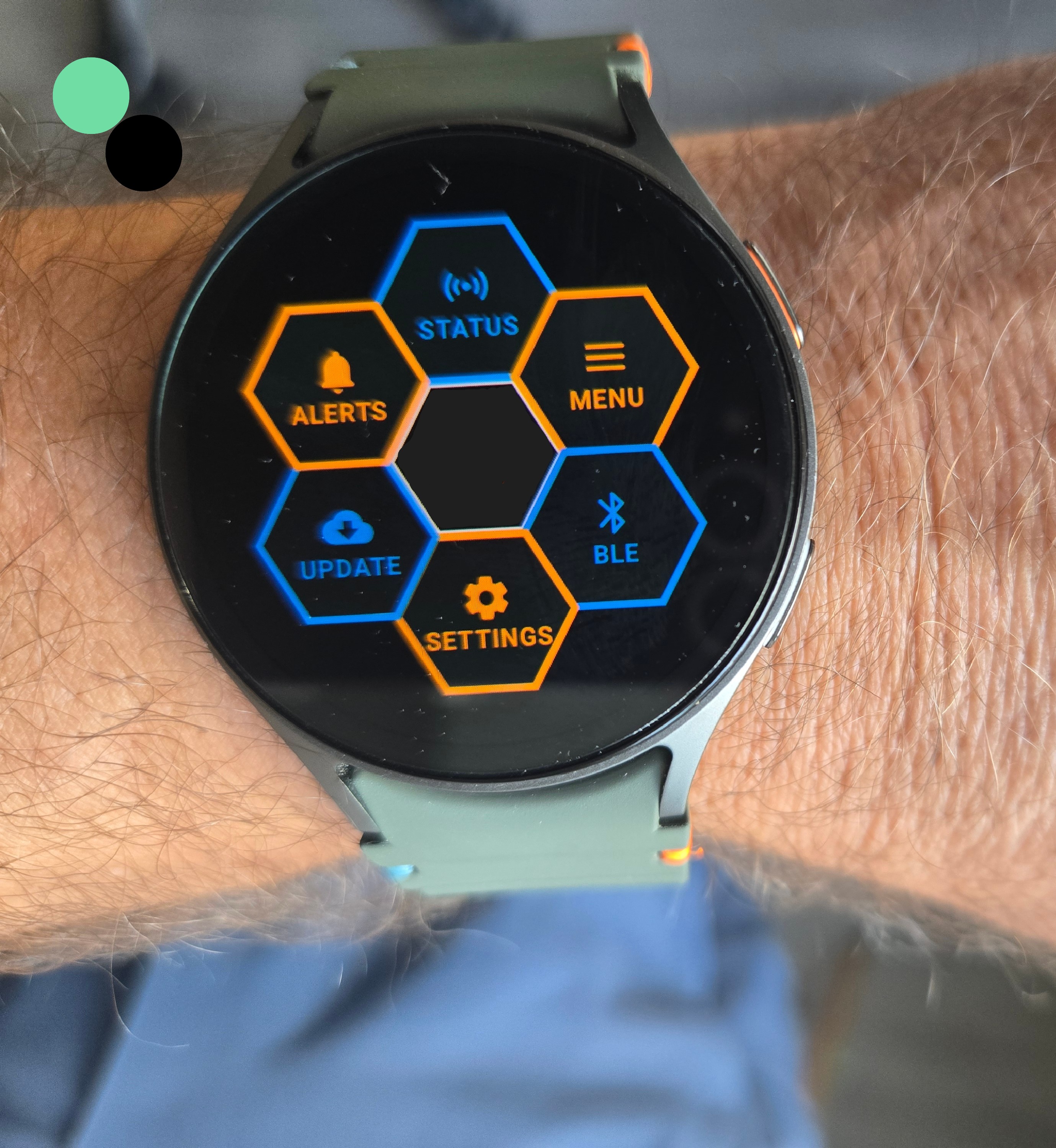 RoadDefender wearable interface running on a Samsung Galaxy Watch, worn on a worker's wrist in the field